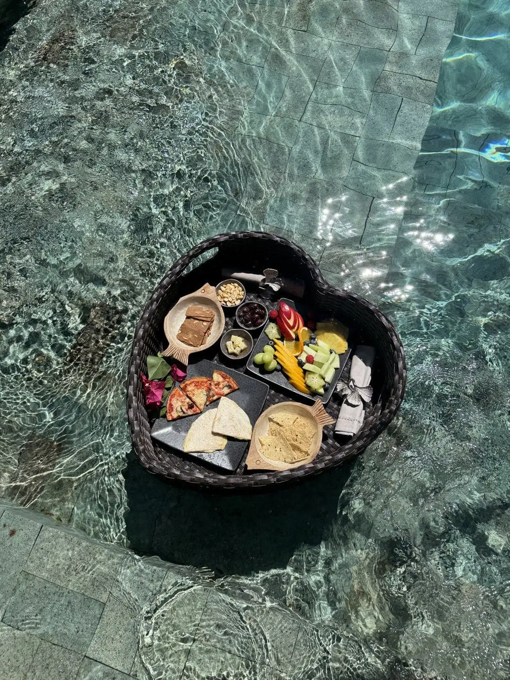 Floating breakfast and snack tray in the villa pool